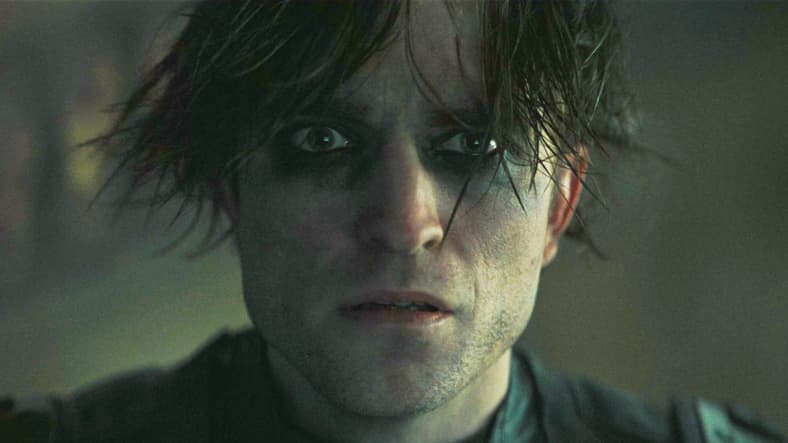 Bruce Wayne (Robert Pattinson) learns of The Riddler's (Paul Dano) actual plans in The Batman (2022), Warner Bros. Pictures
