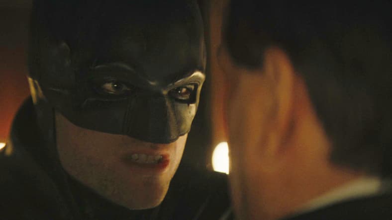 Batman (Robert Pattinson) demands answers from The Penguin (Colin Farrell) in The Batman (2022), Warner Bros. Pictures