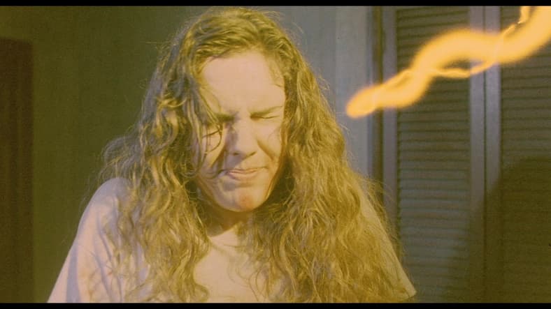 Kirsty (Ashley Laurence) is blinded by the light and revved up in Hellraiser (1987), New World Pictures