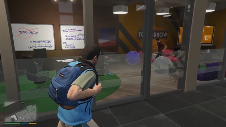 Michael De Santa (Ned Luke) walks through Lifeinvader's office in Grand Theft Auto V (2013), Rockstar Games