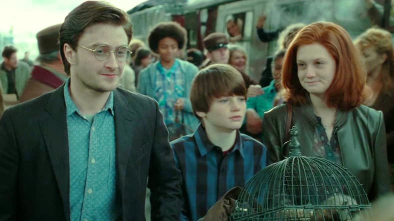 Harry (Daniel Radcliffe) and Ginny (Bonnie Wright) see James (Will Dunn) off to Hogwarts in Harry Potter and the Deathly Hallows - Part 2 (2011), Warner Bros. Pictures