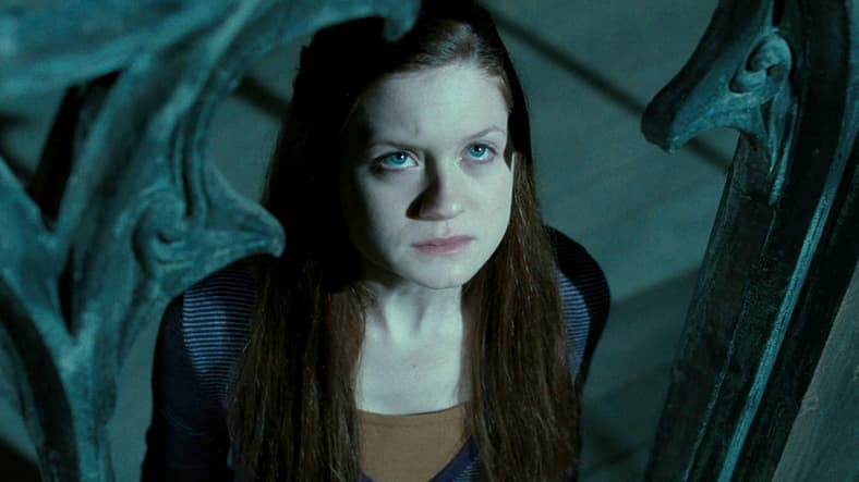 Ginny (Bonnie Wright) watches on as Lord Voldemort (Ralph Fiennes) attempts to break down the shield protecting Hogwarts in Harry Potter and the Deathly Hallows - Part 2 (2011), Warner Bros. Pictures