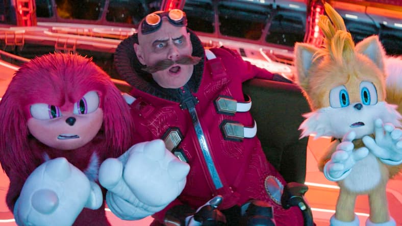 Knuckles (Idris Elba), Dr. Robotnik (Jim Carrey), and Tails (Colleen O'Shaughnessey) are caught off-guard by their accidental cutting of the Moon in Sonic the Hedgehog 3 (2024), Paramount Pictures