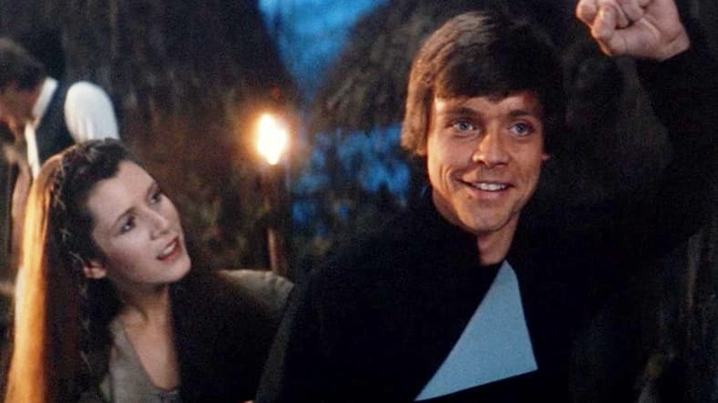 Leia (Carrie Fisher) invites a nostalgic Luke Skywalker (Mark Hamill) back to their post-victory celebration in Star Wars: Episode VI - Return of the Jedi (1985), Lucasfilm