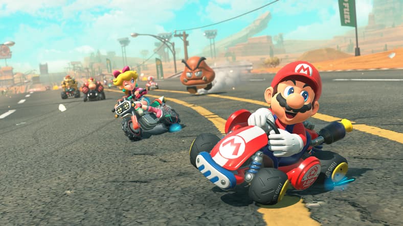 Mario (Kevin Z. Afghani) delighted as he drifts through the desert in Mario Kart World (2025), Nintendo