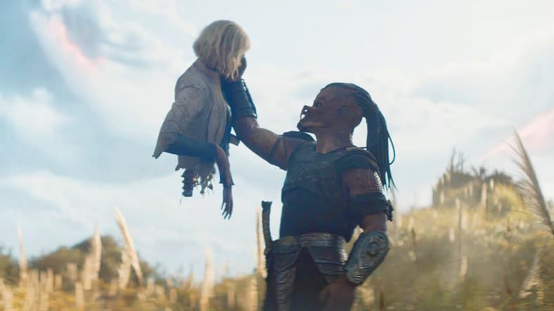 Dek (Dimitrius Schuster-Koloamatangi) makes the acquaintance of Thia (Elle Fanning) in Predator: Badlands (2025), 20th Century Studios