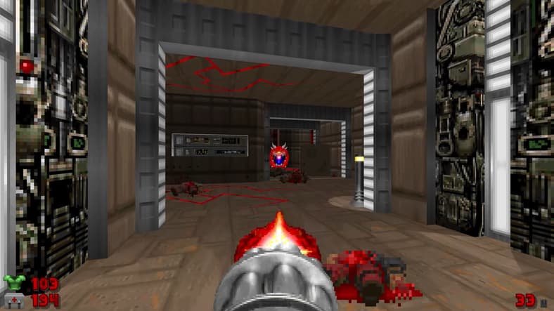 The player blasts a Cacodemon with a minigun via SIGIL 2 (2024) in DOOM II (1994), idSoftware