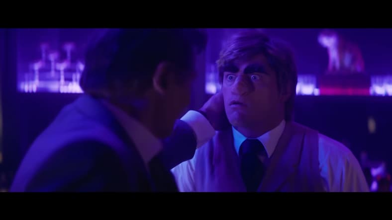 Frank Drebin Jr. (Liam Neeson) punches a bartender (Cody Rhodes) ugly in The Naked Gun (2025), Paramount Pictures