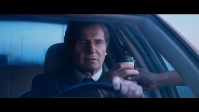 Frank Drebin Jr. (Liam Neeson) doesn't stop for coffee in The Naked Gun (2025), Paramount Pictures