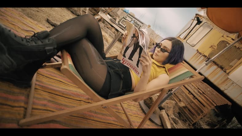 Faye (Daniella Pineda) kicks back with a good book in Cowboy Bebop Season 1 Episode 7 "Galileo Hustle" (2021), Netflix