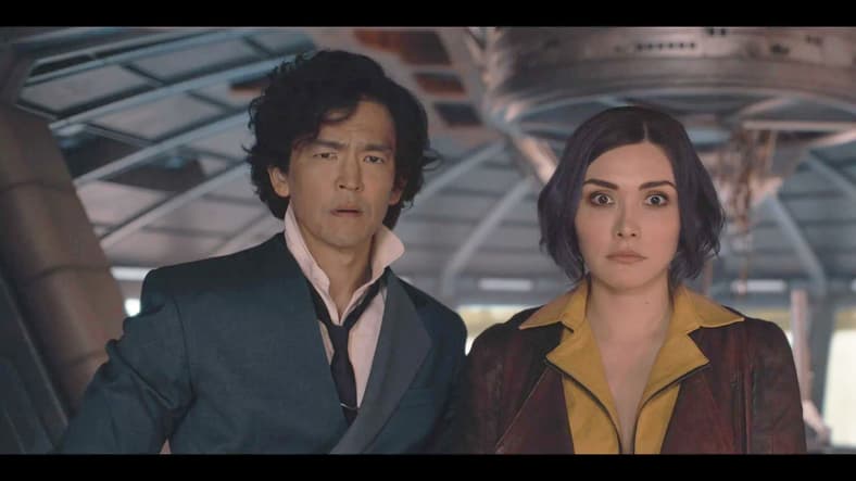 Spike (John Cho) and Faye (Daniella Pineda) are shocked by Whitney's (Christine Dunford) boldness in Cowboy Bebop Season 1 Episode 7 "Galileo Hustle" (2021), Netflix