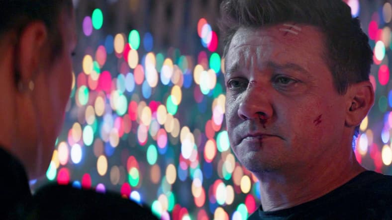 Clint (Jeremy Renner) puts himself at the mercy of Yelena (Florence Pugh) in Hawkeye Episode 6 "So This Is Christmas?" (2021), Marvel Entertainment