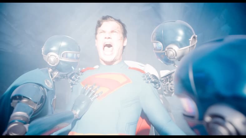 Superman (David Corenswet) roars in pain as yellow sunlight rushes his body back together in Superman (2025), DC Studios