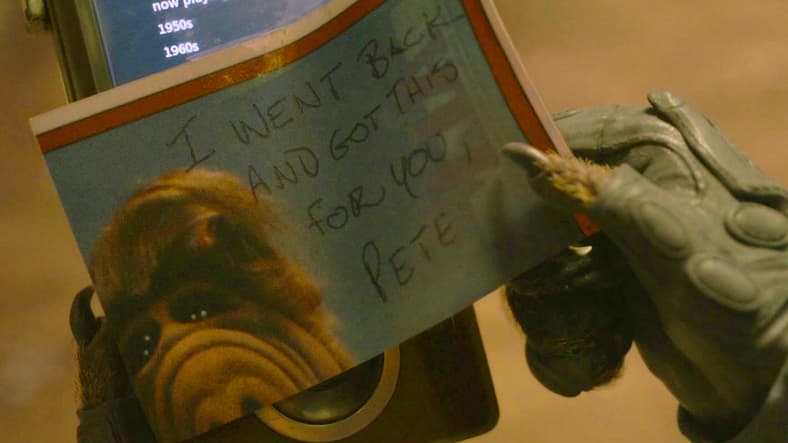 Rocket Raccoon (Bradley Cooper) receives a parting gift from Star-Lord (Chris Pratt) in Guardians of the Galaxy, Vol. 3 (2023), Marvel Entertainment