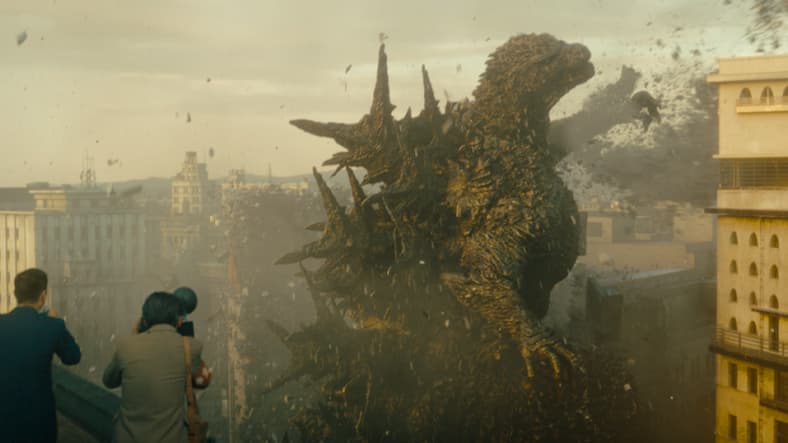 A news crew watches on as Godzilla rampages through Tokyo's Ginza district in Godzilla Minus one (2023), Toho Co. Ltd.