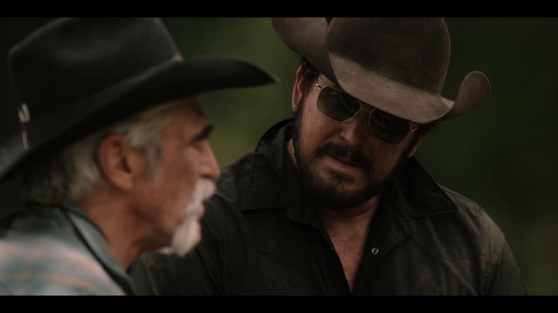 Rip Wheeler (Cole Hauser) speaks with Lloyd (Forrie J. Smith) at John Dutton's (Kevin Costner) grave in Yellowstone Season 5 Episode 14 "Life is a Promise" (2024), Paramount
