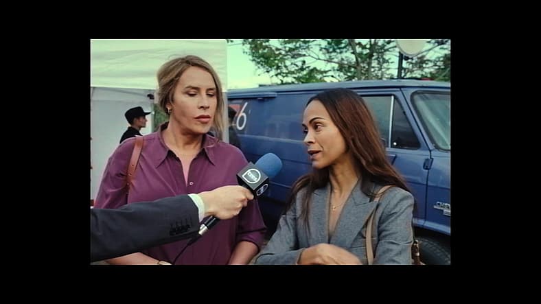 Emilia and Rita discuss their non-profit organization in Emilia Pérez (2024), Netflix