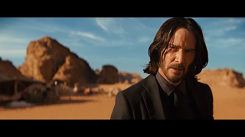 John Wick (Keanu Reeves) questions Elder (George Georgiou) in John Wick: Chapter 4 (2023)