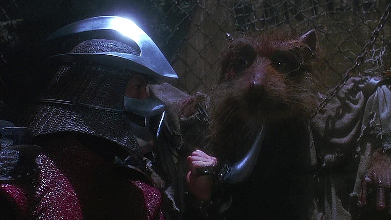 Master Splinter (Kevin Clash) threatened by Shredder (David McCharen/James Saito) in Teenage Mutant