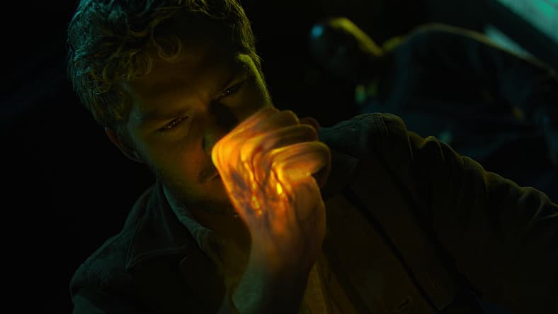 Danny Rand (Finn Jones) prepares to strike Luke Cage (Mike Colter) with Iron Fist in The Defenders