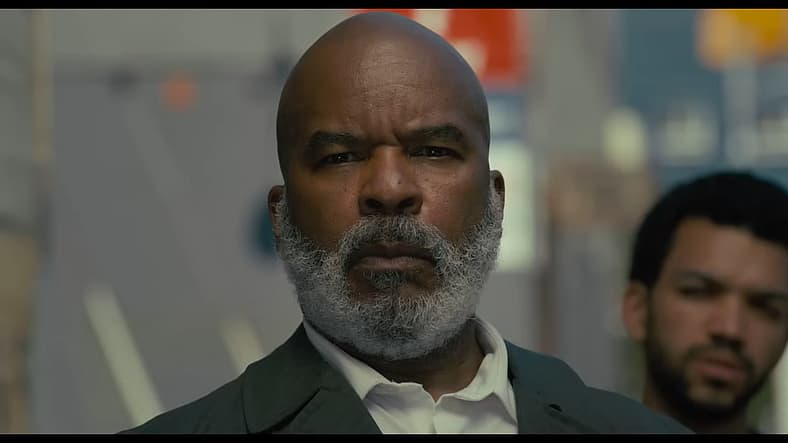 David Alan Grier as Roger and Justice Smith as Aren in The American Society of Magical Negroes