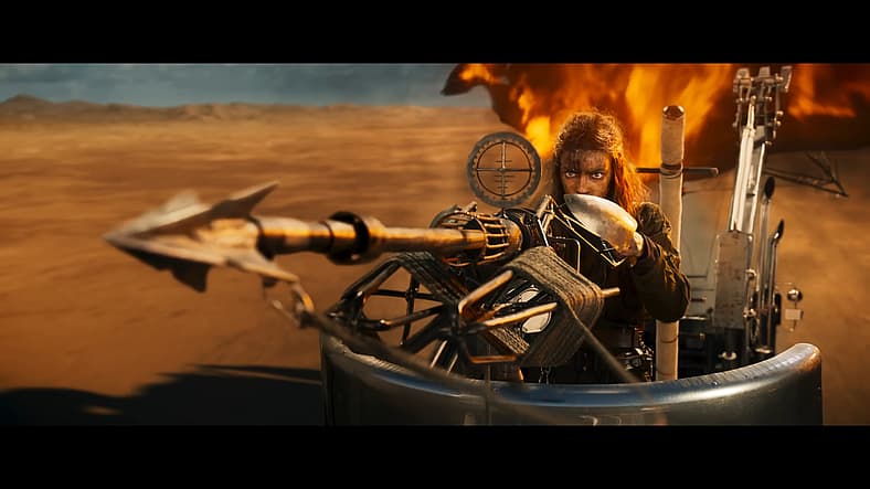 Furiosa takes aim with a harpoon gun in Furiosa: A Mad Max Saga (2024)