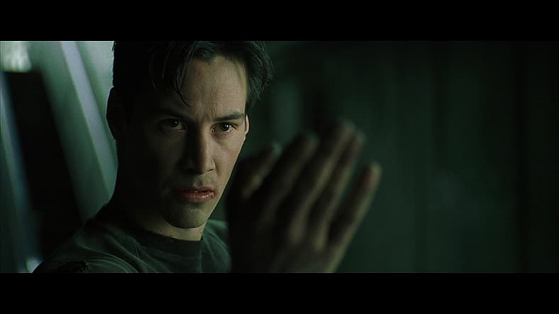 Neo (Keanu Reeves) goads on Agent Smith (Hugo Weaving) in The Matrix (1999), Warner Bros. Pictures