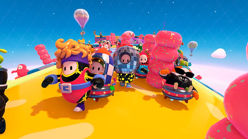 Costumed contestants run through a colorful course in Fall Guys (2020), Epic Games