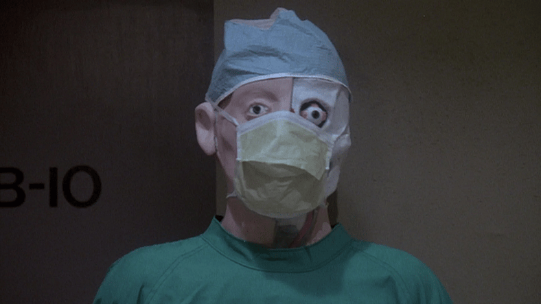Dr. Hill orders his reanimated body to kidnap Megan in Re-Animator (1985), Empire International