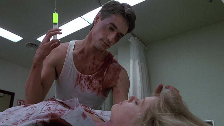 Dan makes a desperate play to save Megan in Re-Animator (1985), Empire International Pictures