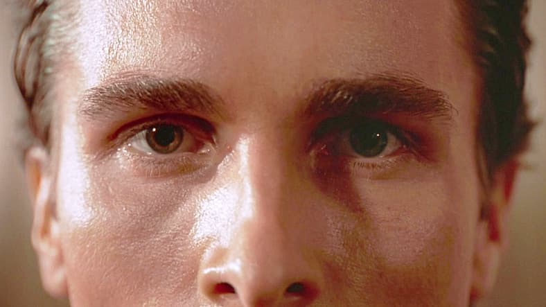 Patrick Bateman (Christian Bale) wants to share his pain in American Psycho (2000), Lionsgate Films