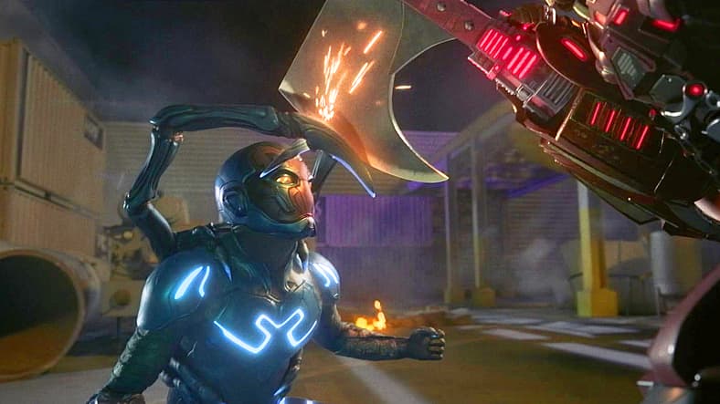 Jamie Reyes (Xolo Maridueña) blocks Carapax's axe-strike in Blue Beetle (2023), DC Studios