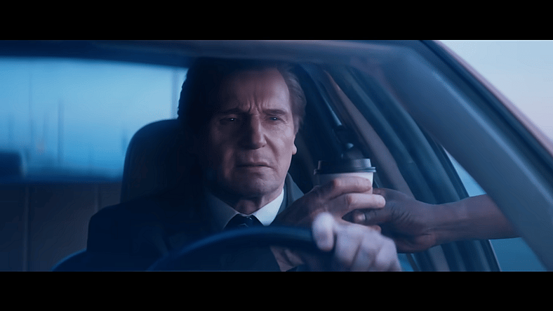 Frank Drebin Jr. (Liam Neeson) doesn't stop for coffee in The Naked Gun (2025), Paramount Pictures