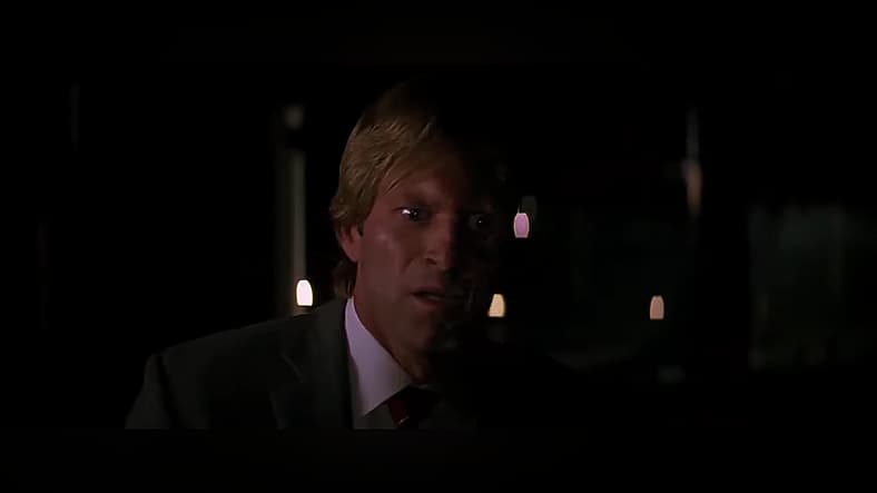 Harvey Dent isn't expecting to escape fate in The Dark Knight (2008), Warner Bros. Pictures