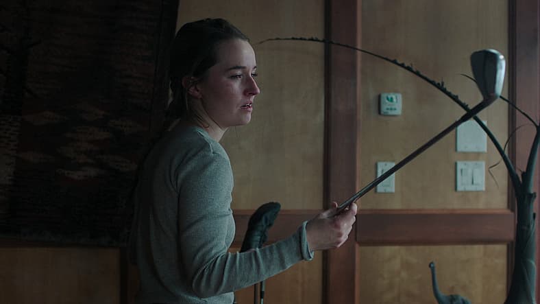Abby (Kaitlyn Dever) decides upon her weapon of choice in The Last of Us Season 2 Episode 2