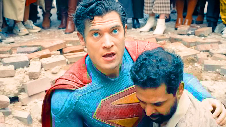 The Man of Steel (David Corenswet) receives some help up from Mali (Dinesh Thyagarajan) after taking a knocking from the Hammer of Boravia in Superman (2025), DC Studios