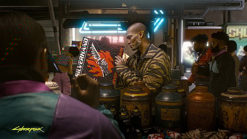 A fan picks up a Silverhand album in Cyberpunk 2077 (2020), CD Projekt Red