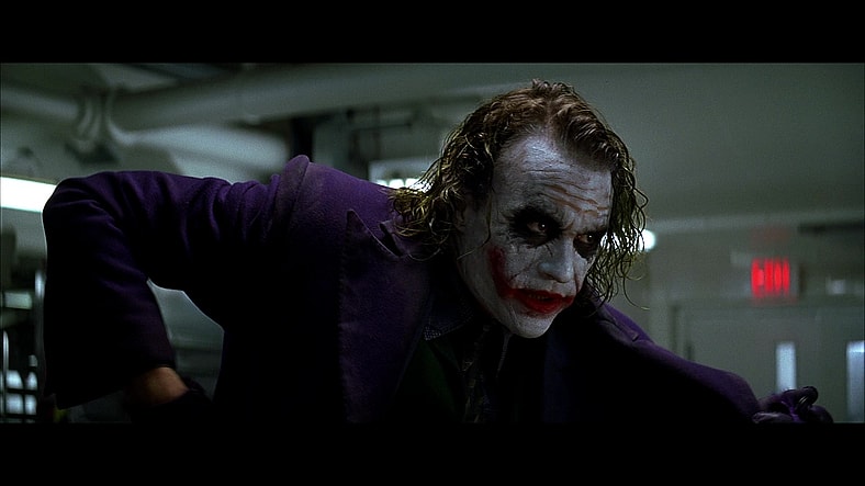 Joker (Heath Ledger) doesn't want to blow things out of proportion in The Dark Knight (2008), Warner Bros. Pictures