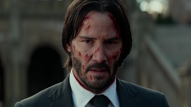 John Wick (Keanu Reeves) learns from Winston (Ian McShane) that he has been deemed 'excommunicado' in John Wick: Chapter 2 (2017), Lionsgate