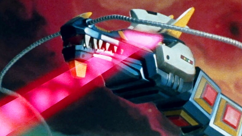Retsu Ichijoji (Kenji Ohba) calls upon the Electronic Starbeast Dol for an emergency save in Space Sheriff Gavan Episode 1 "The Strange Fortress Beneath Tokyo" (1982), Toei Co. Ltd.