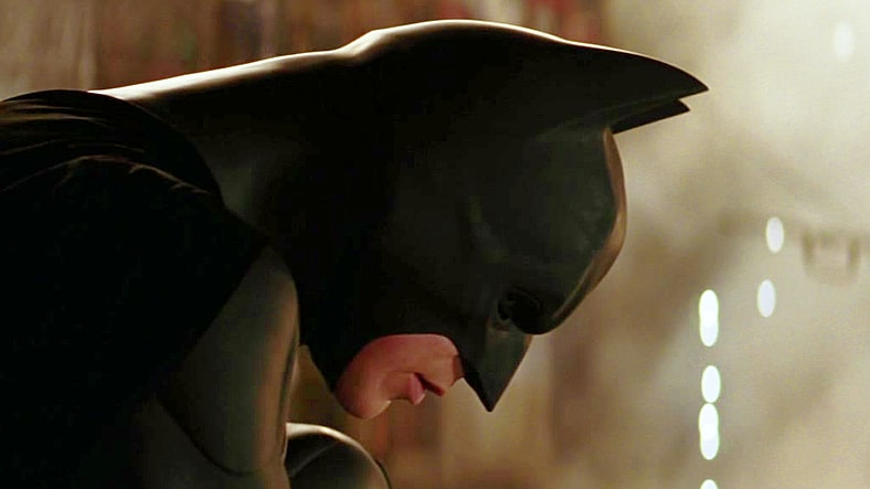Batman (Christian Bale) readies himself for a possible suicide mission in Batman Begins (2005), Warner Bros. Pictures