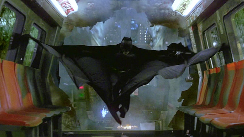 Batman (Christian Bale) leaves Ra's al Ghul (Liam Neeson) to his fate in Batman Begins (2005), Warner Bros. Pictures