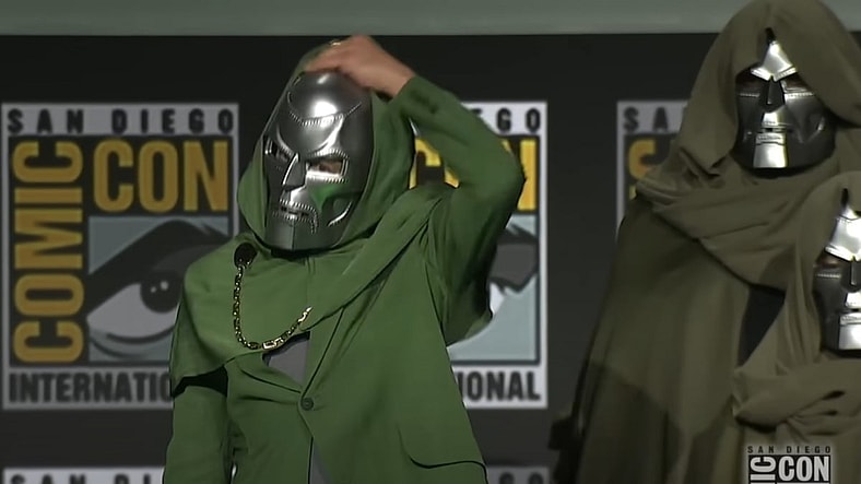 Tony Stark wearing the Doctor Doom mask at Comic Con 2024, Marvel Entertainment, Screenshot via Attractions Magazine