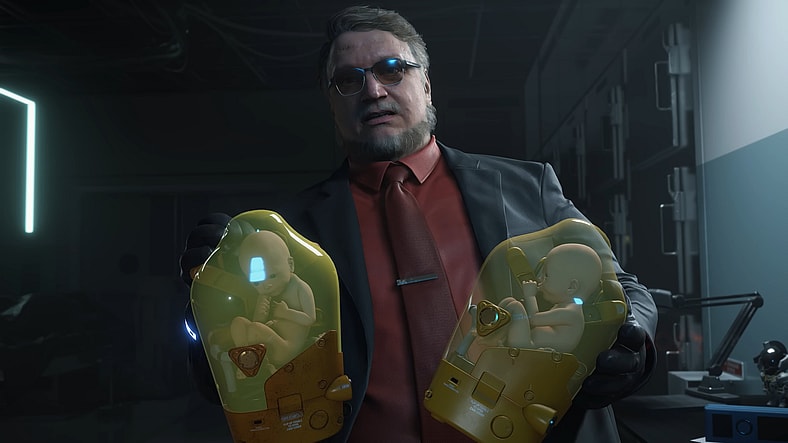 Deadman (Guillermo del Toro) introduces Sam (Norman Reedus) to his new BB models in Death Stranding 2: On the Beach (2025), Kojima Productions