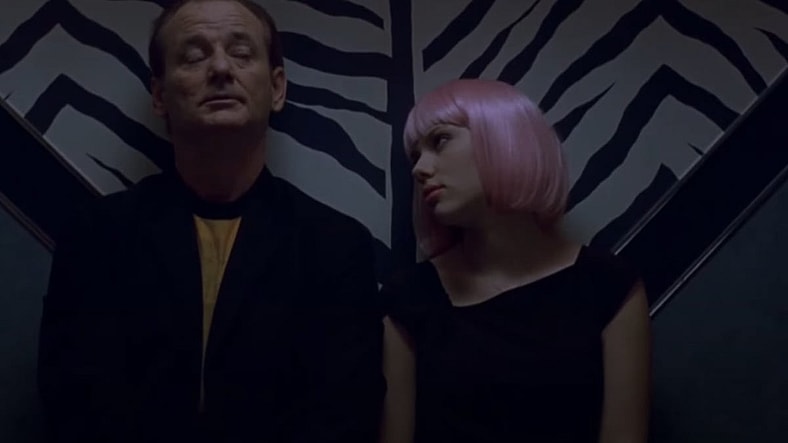 Bob Harris (Bill Murray) and Charlotte (Scarlett Johansson) in a karaoke bar in Lost in Translation (2003), Focus Pictures