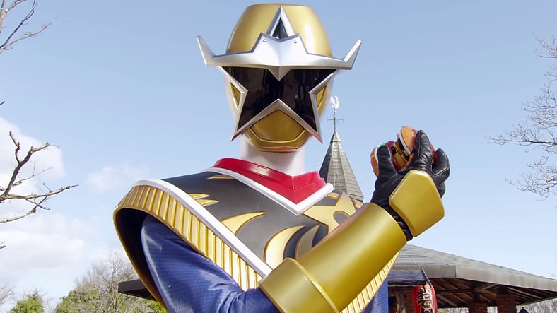 Kinji Takigawa (Hideya Tawada) reveals himself as Star Ninger in Shuriken Sentai Ninninger Episode 10 "Yee-haw! The Gold Star Ninger" (2015), Toei Co. Ltd.
