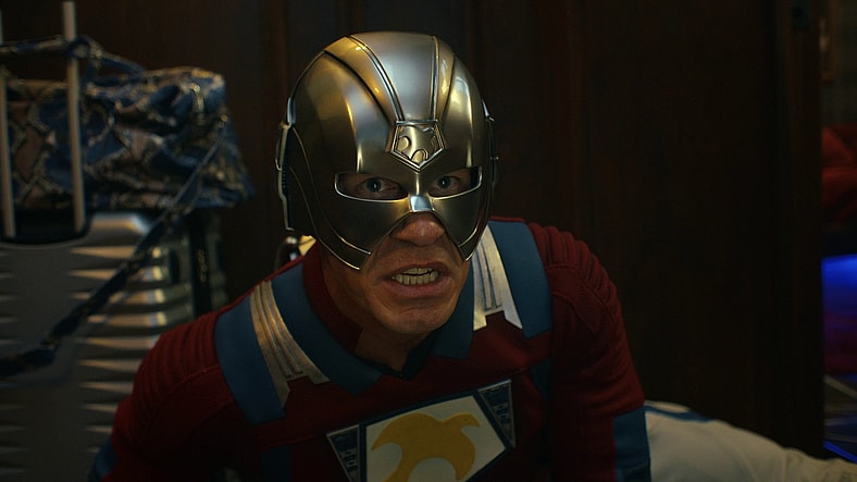 The Earth-2 Peacemaker (John Cena) prepares to launch a pair of helmet-fired ninja stars in Peacemaker Season 2 Episode 1 "The Ties That Grind" (2025), DC Studios