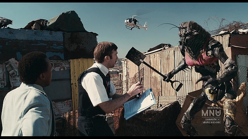 Wikus (Sharlto Copley) wants to see the alien's papers in District 9 (2009), Sony Pictures