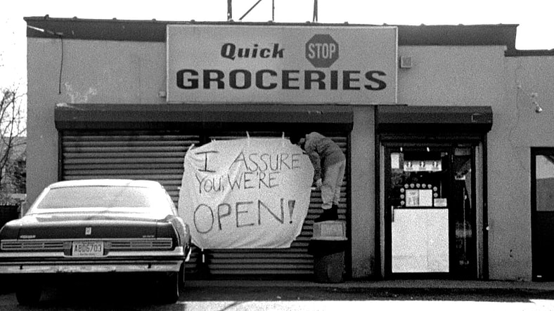 Dante (Brian O'Halloran) attempts to assure customers that the Quick Stop is open in Clerks (1994), View Askew Productions