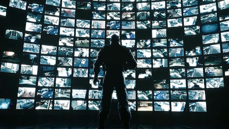 Mute (Gary Milner) looks out on CCTV feeds he's about to cut off in Tom Clancy's Rainbow Six Siege (2015) Ubisoft